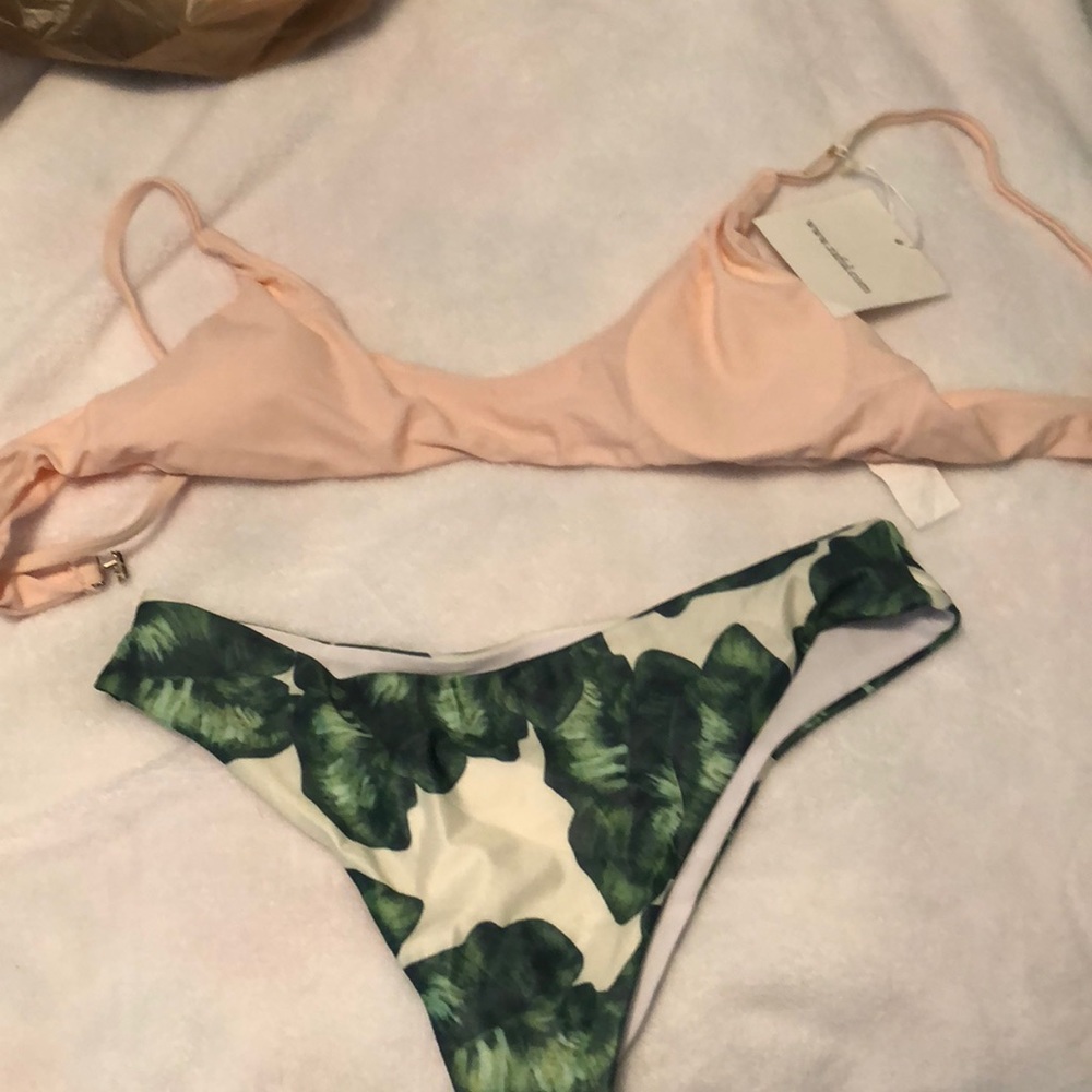 Pink bikini top with floral bottoms.